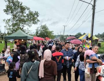 Pesona Wisata Sawah Pelangi Pelawan Tarik Ribuan Pengunjung